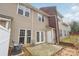 Backyard patio is perfect for gatherings, set against the backdrop of a well-maintained exterior at 3010 Uxbridge Woods Ct, Charlotte, NC 28205