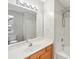 Bathroom featuring a large mirror, single sink, shower, and toilet at 3010 Uxbridge Woods Ct, Charlotte, NC 28205