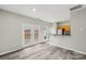 Dining area with patio doors and breakfast bar, offering seamless flow and plenty of natural light at 3010 Uxbridge Woods Ct, Charlotte, NC 28205