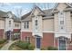 Charming exterior view showcasing brick and siding, a welcoming entrance, and tasteful landscaping at 3010 Uxbridge Woods Ct, Charlotte, NC 28205