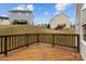 Relax on this backyard wood deck with a wood railing and views of neighboring houses at 302 Flanders Dr, Mooresville, NC 28117