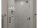 Modern shower with glass door, grey tiles and built-in niche at 302 Flanders Dr, Mooresville, NC 28117