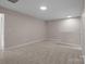 Unfurnished bedroom with neutral carpet, and a walk-in closet at 302 Flanders Dr, Mooresville, NC 28117