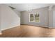 Bright dining room featuring hardwood flooring and a large window at 302 Flanders Dr, Mooresville, NC 28117