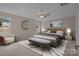 Nicely staged primary bedroom featuring a stylish bed, bench, decor, and natural light at 302 Flanders Dr, Mooresville, NC 28117