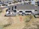 A high angle aerial view of the back of the house with an open yard and a partially covered patio area at 304 Valley Brook Se Ln, Concord, NC 28025