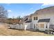 Back exterior view of home with white siding, fenced yard, and patio area perfect for outdoor living at 304 Valley Brook Se Ln, Concord, NC 28025