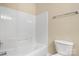 Bright bathroom with a tub and shower combination and a white toilet at 304 Valley Brook Se Ln, Concord, NC 28025