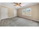 Bedroom with carpet floors, ceiling fan, and neutral walls at 304 Valley Brook Se Ln, Concord, NC 28025