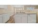 Kitchen with stainless steel sink and white cabinets at 304 Valley Brook Se Ln, Concord, NC 28025