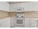 Kitchen featuring white cabinets and appliances at 304 Valley Brook Se Ln, Concord, NC 28025