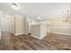 Open-concept living room featuring wood floors, white trim, and natural light at 304 Valley Brook Se Ln, Concord, NC 28025