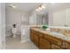 This bathroom offers a double vanity with granite countertop at 3101 Colvard Park Way, Charlotte, NC 28269