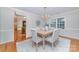 Elegant dining room featuring hardwood floors, a chandelier, and a view of the kitchen at 3101 Colvard Park Way, Charlotte, NC 28269