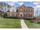 Traditional brick home with manicured lawn, walkway, blue shutters, and a gabled roof on a sunny day at 3101 Colvard Park Way, Charlotte, NC 28269