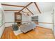 Inviting living room with a cozy fireplace, exposed wood beams, ceiling fan, and hardwood floors at 3101 Colvard Park Way, Charlotte, NC 28269