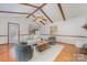 Cozy living room with hardwood floors, exposed wood beams, brick fireplace, and natural light at 3101 Colvard Park Way, Charlotte, NC 28269