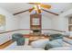 Bright living room with hardwood floors, exposed wood beams, and a brick fireplace at 3101 Colvard Park Way, Charlotte, NC 28269