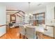 Cozy dining area with wood floors and a view of the living room fireplace at 3101 Colvard Park Way, Charlotte, NC 28269