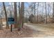 The Clarks Creek Greenway sign marks a trail through a wooded area at 3101 Colvard Park Way, Charlotte, NC 28269