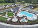 Community amenities including a large pool, firepit, outdoor kitchens, bocce ball, and tennis courts at 316 Basil Dr, Indian Trail, NC 28079