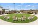 Outdoor green space featuring lounge chairs, a grassy lawn, and mature landscaping at 316 Basil Dr, Indian Trail, NC 28079