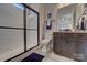 Bathroom featuring a modern glass enclosed shower and dark wood vanity at 316 Basil Dr, Indian Trail, NC 28079