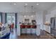 Modern kitchen with white cabinetry, stainless steel appliances, and an island with bar seating at 316 Basil Dr, Indian Trail, NC 28079