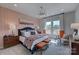 Stylishly decorated main bedroom with patterned wallpaper, two side tables and plenty of natural light at 316 Basil Dr, Indian Trail, NC 28079