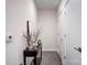 Hallway with gray luxury vinyl plank flooring and a console table with artwork at 3630 N Davidson St, Charlotte, NC 28205