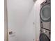 Laundry room features a new, stacked, front-loading washer and dryer at 3630 N Davidson St, Charlotte, NC 28205