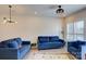 Stylish living room with plenty of seating, modern lighting and large windows for natural light at 3630 N Davidson St, Charlotte, NC 28205