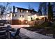 Exterior of home at night features manicured landscaping and a stone patio with fire pit at 368 Fairfield Ct, Mount Gilead, NC 27306