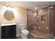 Updated bathroom featuring black vanity and tiled shower at 368 Fairfield Ct, Mount Gilead, NC 27306