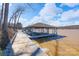 Exterior view of the private dock offering a serene waterfront retreat with boat lift and lake access at 368 Fairfield Ct, Mount Gilead, NC 27306