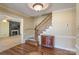 Elegant foyer with hardwood floors, staircase, and decorative lighting, leading to a cozy living space at 368 Fairfield Ct, Mount Gilead, NC 27306