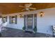 Elegant front door with decorative glass, enhanced by sconces and topiaries, creating an inviting entrance at 368 Fairfield Ct, Mount Gilead, NC 27306