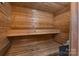 Relaxing in-home sauna features wood paneling and built-in bench at 368 Fairfield Ct, Mount Gilead, NC 27306