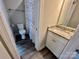 Bathroom featuring a modern vanity, stylish shower curtain, and wood-look flooring at 3726 Windy Pine Nw Ln, Hickory, NC 28601