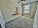 Cozy bedroom featuring neutral walls, plush carpeting, and a bright window for natural light at 3726 Windy Pine Nw Ln, Hickory, NC 28601