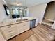 Spacious kitchen island with granite countertop, stainless steel sink, and white cabinetry at 3726 Windy Pine Nw Ln, Hickory, NC 28601