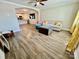 Bright living room with open floor plan, modern furnishings, and wood-look flooring at 3726 Windy Pine Nw Ln, Hickory, NC 28601