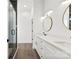 Modern bathroom featuring double sinks, vanity with marble counters, and a frameless glass shower at 4055 Miller Rd, Salisbury, NC 28147