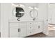 Bathroom featuring a double sink vanity with white cabinets and round mirrors at 4055 Miller Rd, Salisbury, NC 28147