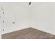 Empty bedroom featuring wood flooring and a door to the closet at 4055 Miller Rd, Salisbury, NC 28147