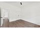 This bedroom features hardwood floors, white walls, and a ceiling fan at 4055 Miller Rd, Salisbury, NC 28147