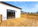 New wood deck with sliding glass door access on a modern-style home, great for outdoor living at 4055 Miller Rd, Salisbury, NC 28147