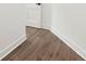 Clean, modern hallway with wood-look flooring and bright white trim at 4055 Miller Rd, Salisbury, NC 28147