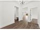 This hallway features white walls, wood-look flooring, and a bench at 4055 Miller Rd, Salisbury, NC 28147