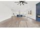 Large living room with hardwood floors and modern fireplace that leads into the modern kitchen at 4055 Miller Rd, Salisbury, NC 28147